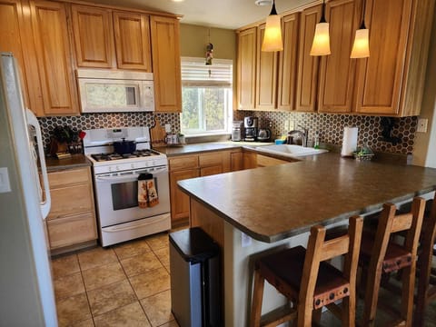 Open concept living, dining and kitchen stocked with everything you may need.  