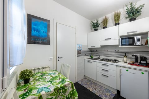 Family Apartment | Private kitchen | Fridge, microwave, stovetop, espresso maker