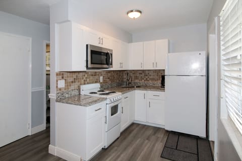 Suite, 2 Queen Beds | Private kitchen | Fridge, microwave, coffee/tea maker, cookware/dishes/utensils