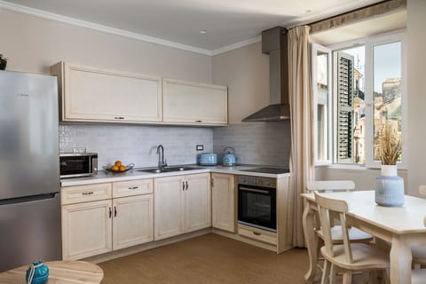 Superior Suite, 2 Bedrooms, Balcony, Sea View | Private kitchen | Fridge, microwave, stovetop, coffee/tea maker