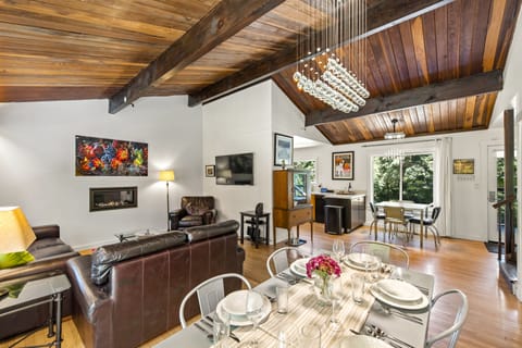 You can see the living room gas fireplace or TV from the dining area or cozy sofas.