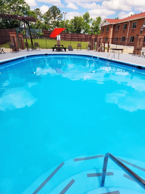 Seasonal outdoor pool, open 9 AM to 9 PM, pool umbrellas, sun loungers
