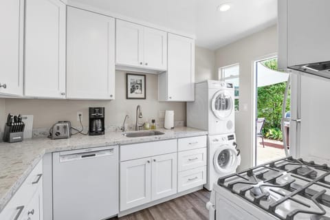 Kitchen: fully stocked with washer and dryer