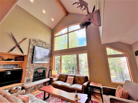 Great room with floor to ceiling windows and plenty of comfy seating