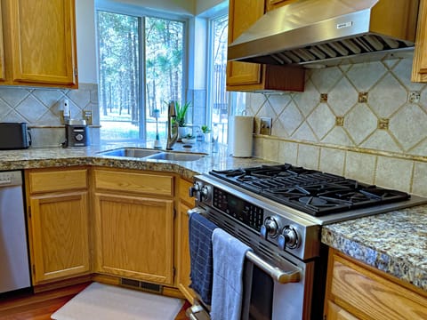 Kitchen: JENN-AIR gas range, Dishwasher, double S/S Sink & Fridge. Seating for10