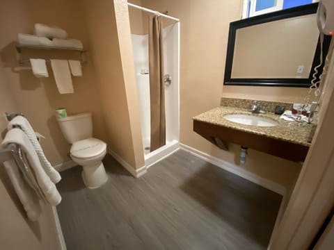 Economy Single Room, 1 Queen Bed | Bathroom | Shower, hair dryer, towels