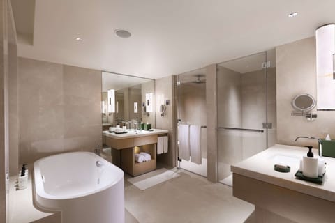 Suite, 1 King Bed (Conrad) | Bathroom | Shower, hydromassage showerhead, free toiletries, hair dryer