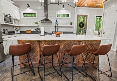 Pull up a stool and let's chat! This kitchen bar is just the spot for morning coffee or an evening glass of wine.