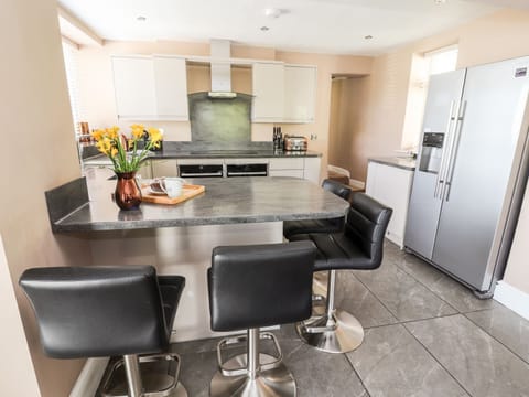 Fridge, electric kettle, cookware/dishes/utensils