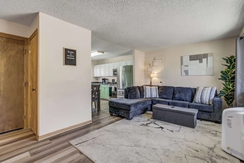 A cozy and inviting living space with plush seating, stylish decor, and an open floor plan that seamlessly connects to the kitchen—perfect for relaxing and gathering with loved ones.