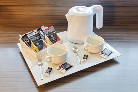 Premium bedding, desk, laptop workspace, blackout drapes