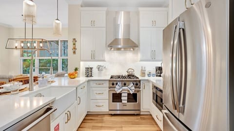 The fully equipped kitchen has top-of-the-line stainless steel appliances...