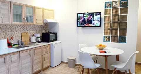 Kitchenette with coffee facilities , living room and a wonderful fireplace!