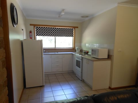 Two Bedroom Apartment | Private kitchen | Full-size fridge, microwave, coffee/tea maker, electric kettle