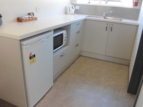 Studio Unit with Kitchenette | Private kitchenette | Fridge, coffee/tea maker, electric kettle