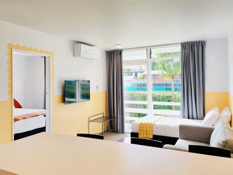 Deluxe Suite, 1 Bedroom, Garden View | Living room | Flat-screen TV