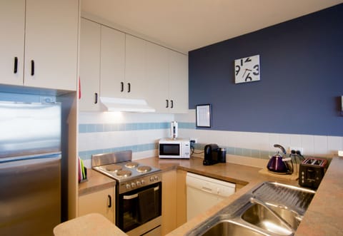 Two Bedroom Apartment | Private kitchen | Full-size fridge, microwave, stovetop, espresso maker