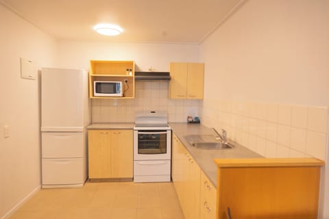 Apartment, 2 Bedrooms (1 Queen and 2 Single beds) | Private kitchen | Microwave, coffee/tea maker, electric kettle