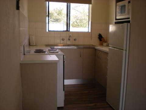 Deluxe Apartment, 2 Bedrooms | Private kitchen | Fridge, microwave, stovetop, coffee/tea maker