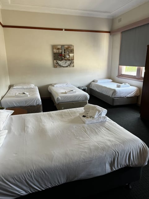 Standard Quadruple Room | Desk, iron/ironing board, free WiFi, bed sheets