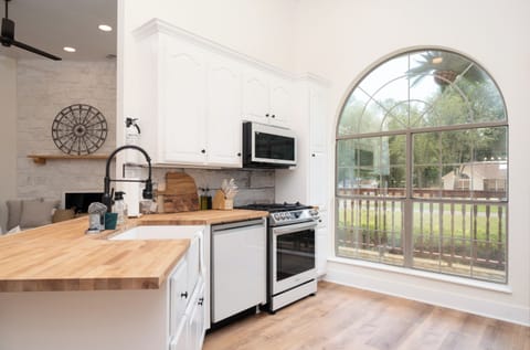 Beautiful brand-new bespoke white glass appliances.