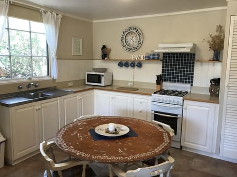 Beachcomber Cottage | Private kitchen | Full-size fridge, microwave, oven, stovetop