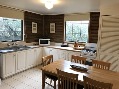 Garden Cottage 1 | Private kitchen | Full-size fridge, microwave, oven, stovetop