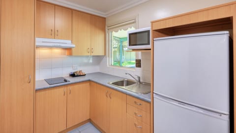 Two Bedroom Executive Apartment | Private kitchen | Fridge, microwave, coffee/tea maker, electric kettle