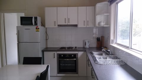 Full-size fridge, microwave, stovetop, coffee/tea maker