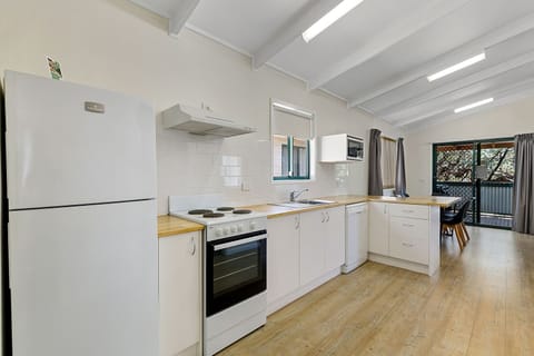 Spa Cottage Two Bedrooms (6 Berth) | Private kitchen | Full-size fridge, microwave, stovetop, electric kettle