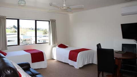 Premium Suite, 1 Bedroom, Non Smoking, Kitchenette | Premium bedding, laptop workspace, iron/ironing board, cribs/infant beds