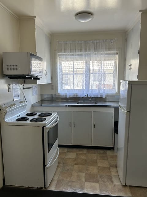 Two-Bedroom Apartment | Private kitchen | Fridge, microwave, electric kettle, toaster