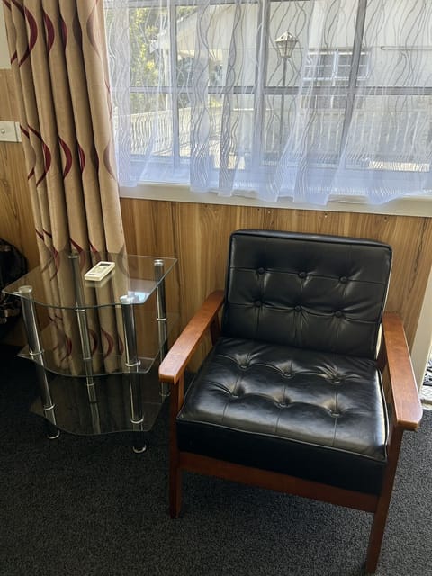 Queen Studio | Living area | 40-inch flat-screen TV with cable channels