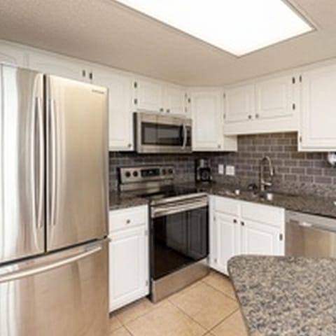 Condo, 2 Bedrooms | Private kitchen | Fridge, oven, coffee/tea maker