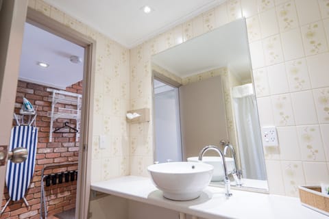 Family Suite, 2 Bedrooms, Garden View | Bathroom | Shower, free toiletries, hair dryer, towels