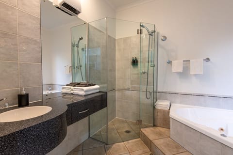 Separate tub and shower, jetted tub, free toiletries, hair dryer