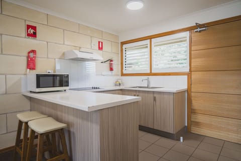 Family Suite | Private kitchen | Fridge, microwave, coffee/tea maker, electric kettle