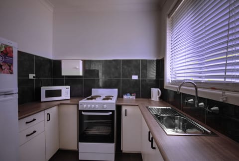 Family Studio | Private kitchen | Fridge, microwave, coffee/tea maker, electric kettle