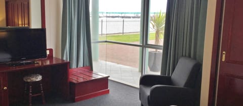 Panoramic Suite, 1 Bedroom, Ocean View | Living area | LCD TV