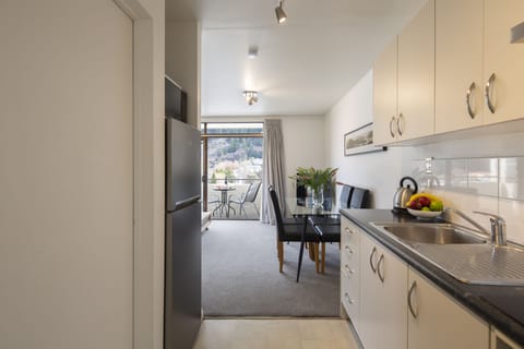 One Bedroom Apartment with Private Balcony | Private kitchen | Fridge, microwave, stovetop, electric kettle