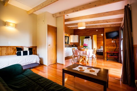 Standard Suite, 1 Bedroom, Non Smoking, Kitchen (HoneyMoon Cottage) | Living room | 32-inch TV with cable channels