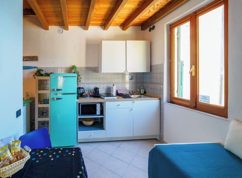 Exclusive Apartment | Private kitchen | Full-size fridge, microwave, stovetop, espresso maker