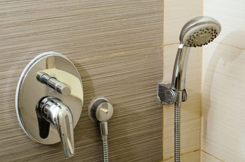 Shower, rainfall showerhead, hair dryer, towels