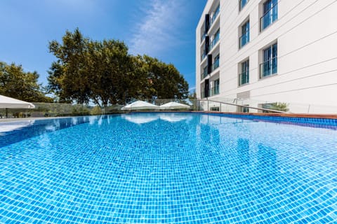 Seasonal outdoor pool, open 10:00 AM to 8:00 PM, sun loungers