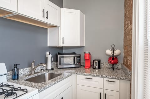 Condo, 1 Queen Bed | Private kitchen | Fridge, microwave, oven, stovetop