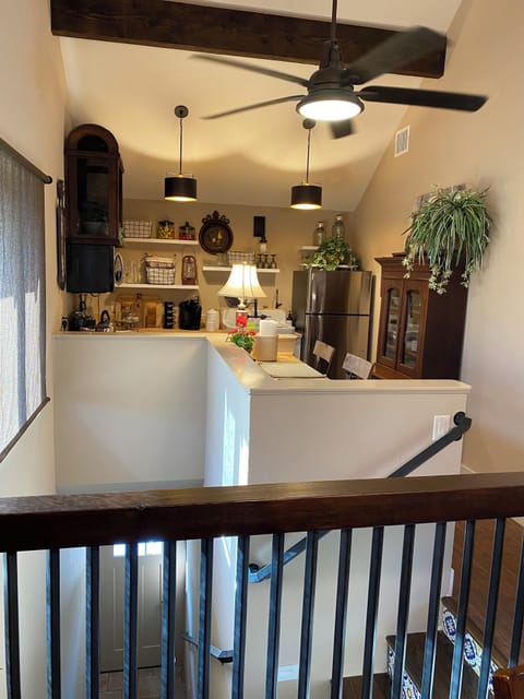 Kitchen area with breakfast bar, looking outside