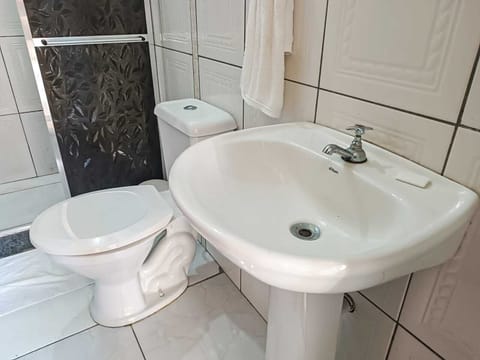 Family Room, Multiple Beds | Bathroom | Shower, towels, soap, toilet paper