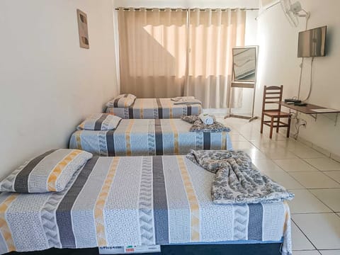 Standard Quadruple Room | Minibar, individually decorated, desk, laptop workspace