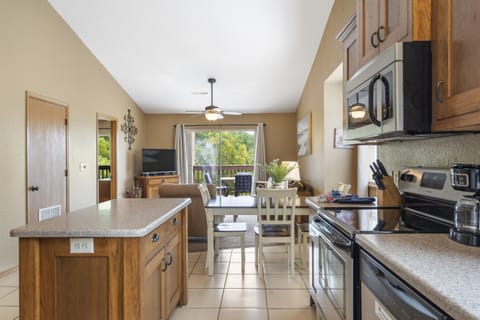 Whip up a delicious meal in the fully equipped kitchen - the heart of your cozy condo that's sure to inspire your inner chef!