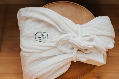 Eco-friendly toiletries, hair dryer, bathrobes, towels